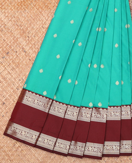 Green Budget Silk Saree, Showcasing Zari Buttas on Its Body, Complemented by a Contrast Traditional Zari Design Rettai Pettu Border, Grand Jaal Design Pallu, and Paired with a Contrast Blouse