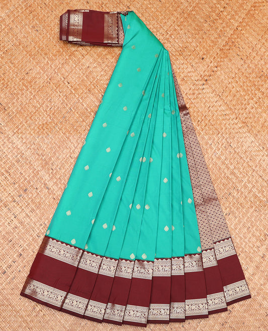 Green Budget Silk Saree, Showcasing Zari Buttas on Its Body, Complemented by a Contrast Traditional Zari Design Rettai Pettu Border, Grand Jaal Design Pallu, and Paired with a Contrast Blouse