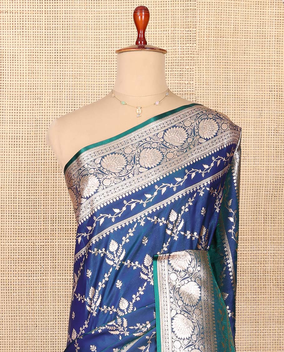 Blue Semi-Banaras Saree, Gracefully Embellished with Jaal Jacquard on Its Body, Highlighted by a Floral Creeper Design Border, Intricately Designed Zari Pallu, and Paired with a Matching Blouse