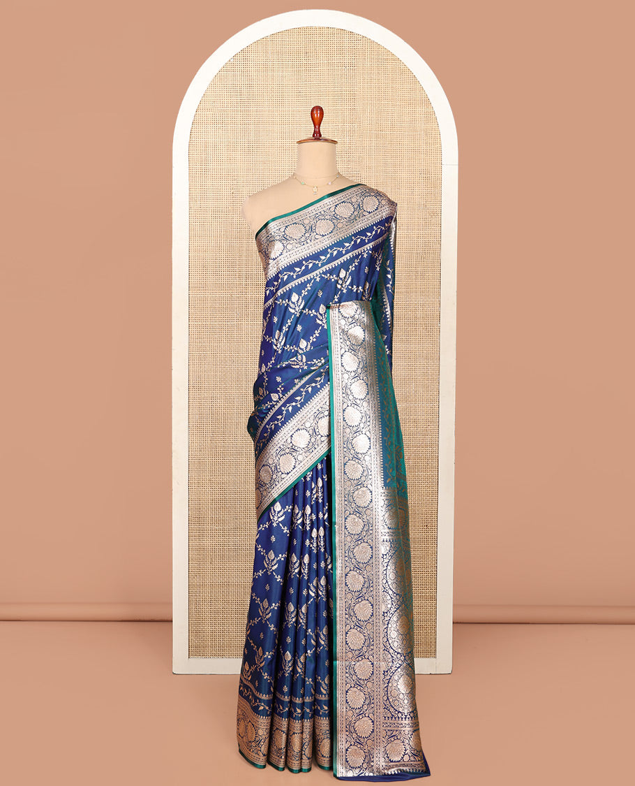 Blue Semi-Banaras Saree, Gracefully Embellished with Jaal Jacquard on Its Body, Highlighted by a Floral Creeper Design Border, Intricately Designed Zari Pallu, and Paired with a Matching Blouse