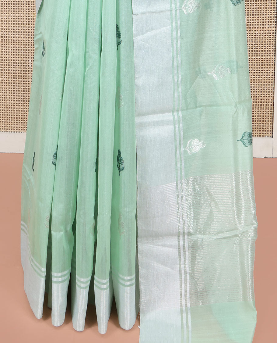 Green Chanderi Cotton Saree, Subtly Decked up with Floral Buttas All Over Its Body, Highlighted by a Bavanji Border, Pallu Steeped with Zari Stripes, and Paired with a Matching Blouse