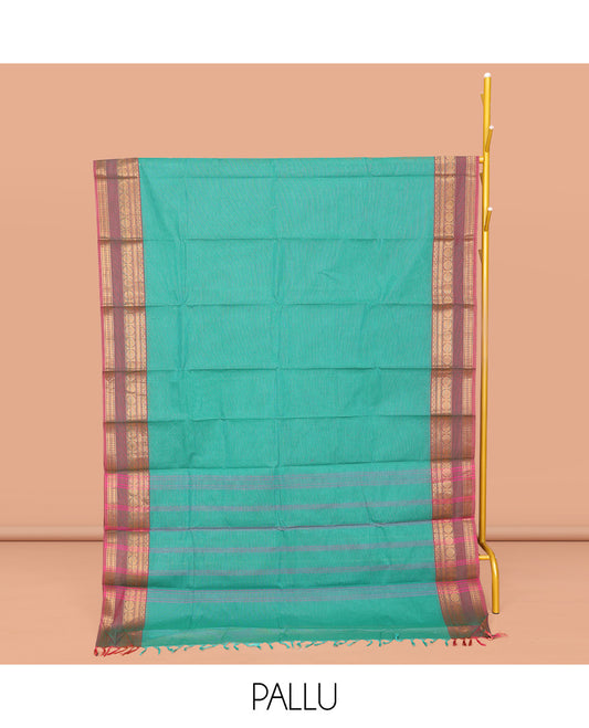 Green Plain Chettinad Cotton Saree, Complemented by a Contrast Traditional Zari Design Border, Subtly Striped Pallu, and Paired with a Matching Blouse