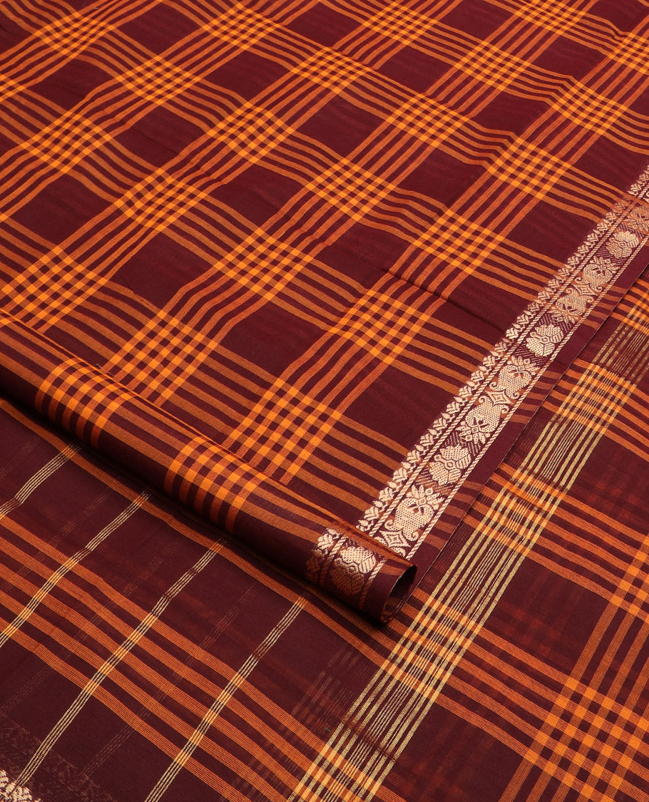 Maroon and orange checked nine-yard cotton saree, traditional motifs border, and striped pallu