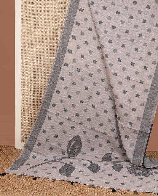 Beige square buttas woven cotton saree, contrast plain border and pallu features a pink flower with stem motifs