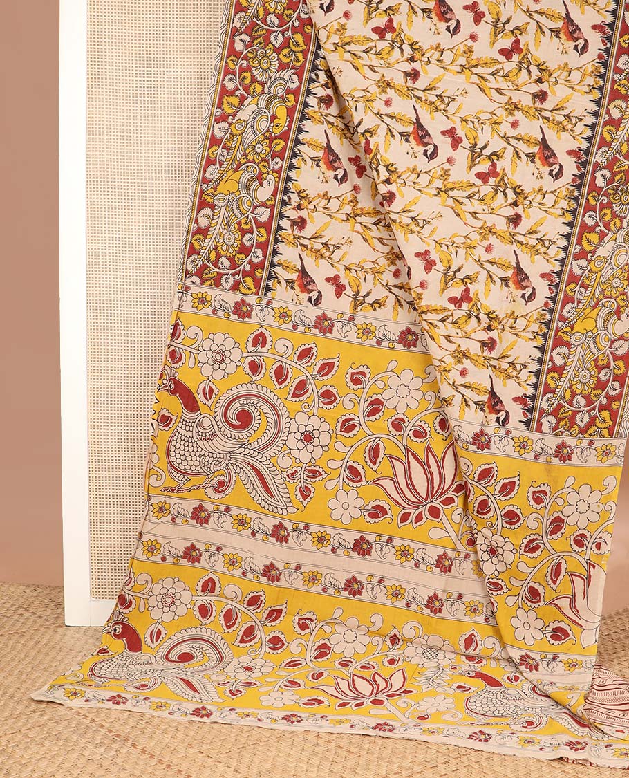 Cream floral, and sparrow machine printed kalamkari cotton saree, contrast floral-peacock border, and pallu of peacocks print