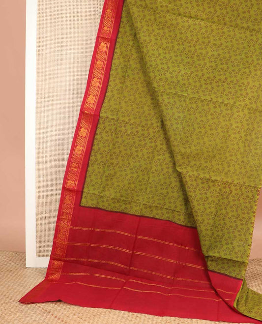 Leaf green floral vine printed sungudi cotton saree, contrast traditional zari border, and zari striped pallu