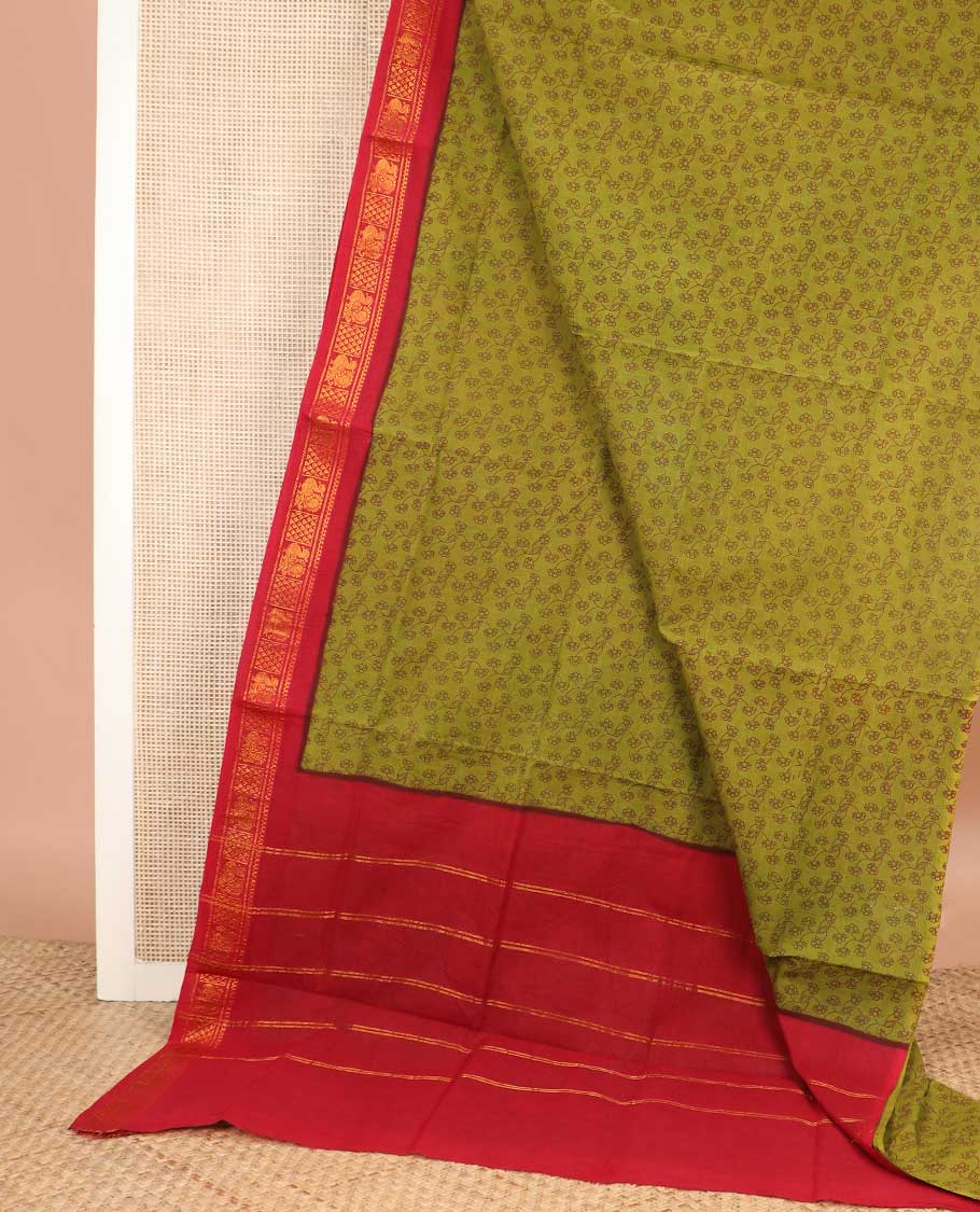 Leaf green floral vine printed sungudi cotton saree, contrast traditional zari border, and zari striped pallu