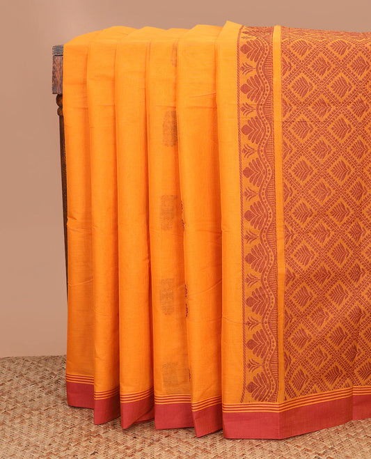 Orange floral buttas kanchi cotton saree, contrast plain border, and jaal pallu