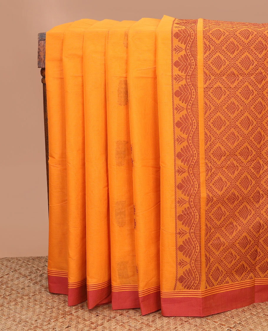 Orange floral buttas kanchi cotton saree, contrast plain border, and jaal pallu
