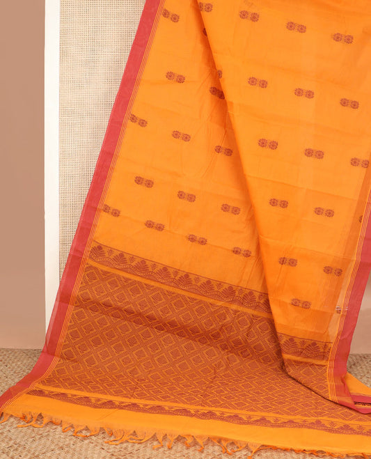 Orange floral buttas kanchi cotton saree, contrast plain border, and jaal pallu
