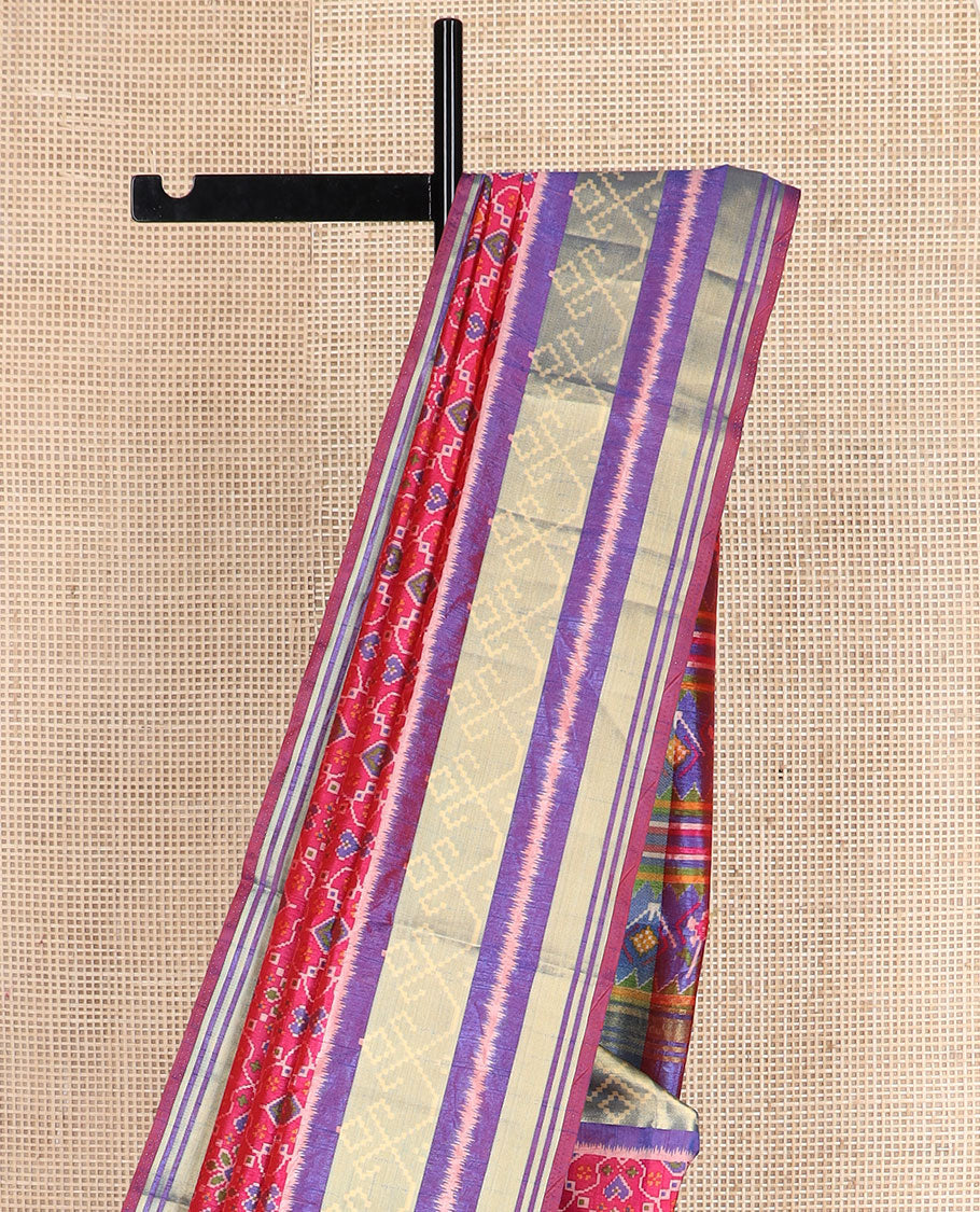 Pink intricately designed patola silk saree, contrast ikkat border, and pallu of stripes