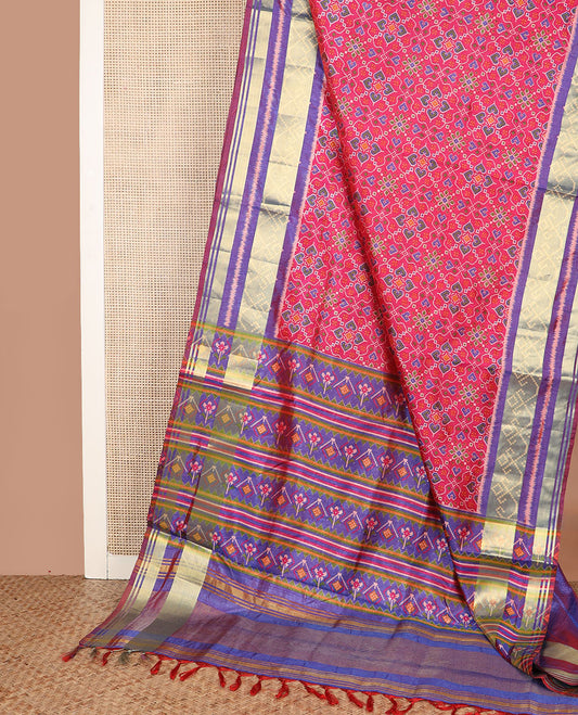 Pink intricately designed patola silk saree, contrast ikkat border, and pallu of stripes