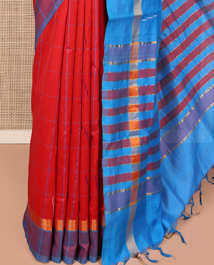 Red Poly Cotton Saree, Bedecked with Butta Enclosed Checks on Its Body, Complemented by Contrast Border, Pallu Steeped with Stripes, and Paired with a Contrast Blouse