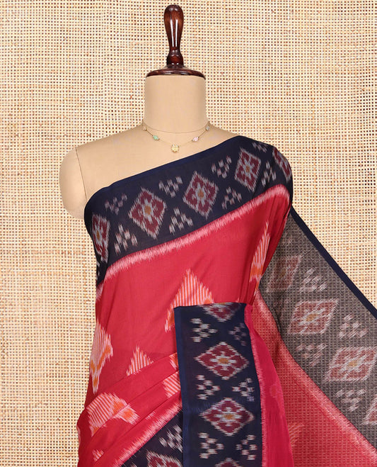 Red Ikkat Cotton Saree, Decorated with Ikkat-style Buttas All Over Its Body, Complemented by a Contrast Ikkat-Textured Border, Pallu of Geometric Patterns, and Paired with a Contrast Blouse