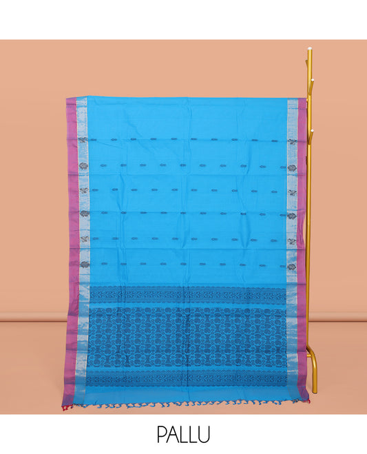Blue Kanchi Cotton Saree, Enthralled with Buttas All Over Its Body, Complemented by a Contrast Border, Pallu of Paisley and Floral Design, and Paired with a Matching Blouse