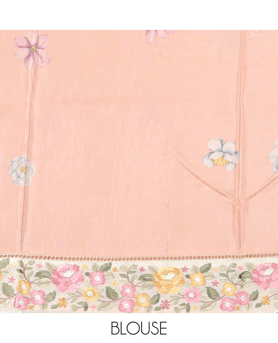 Pastel orange dobby-style buttas dola silk saree, contrast floral embroidered scallop border, and floral printed pallu