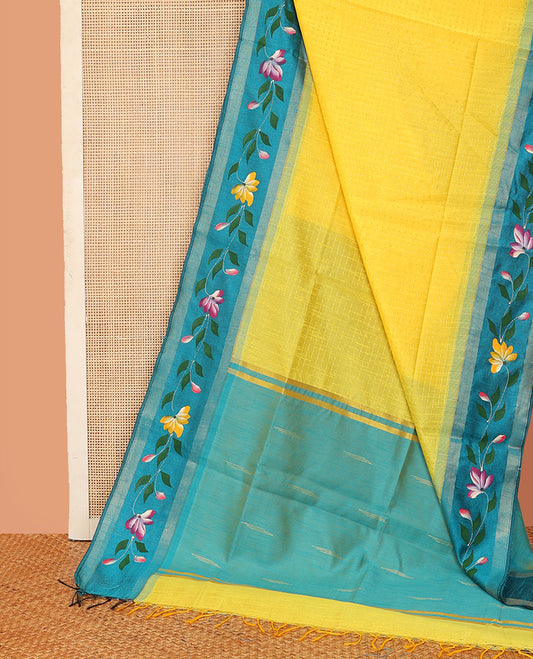Yellow dobbly-style buttas dupion saree, contrast painting-style floral creeper design border, and buttas pallu