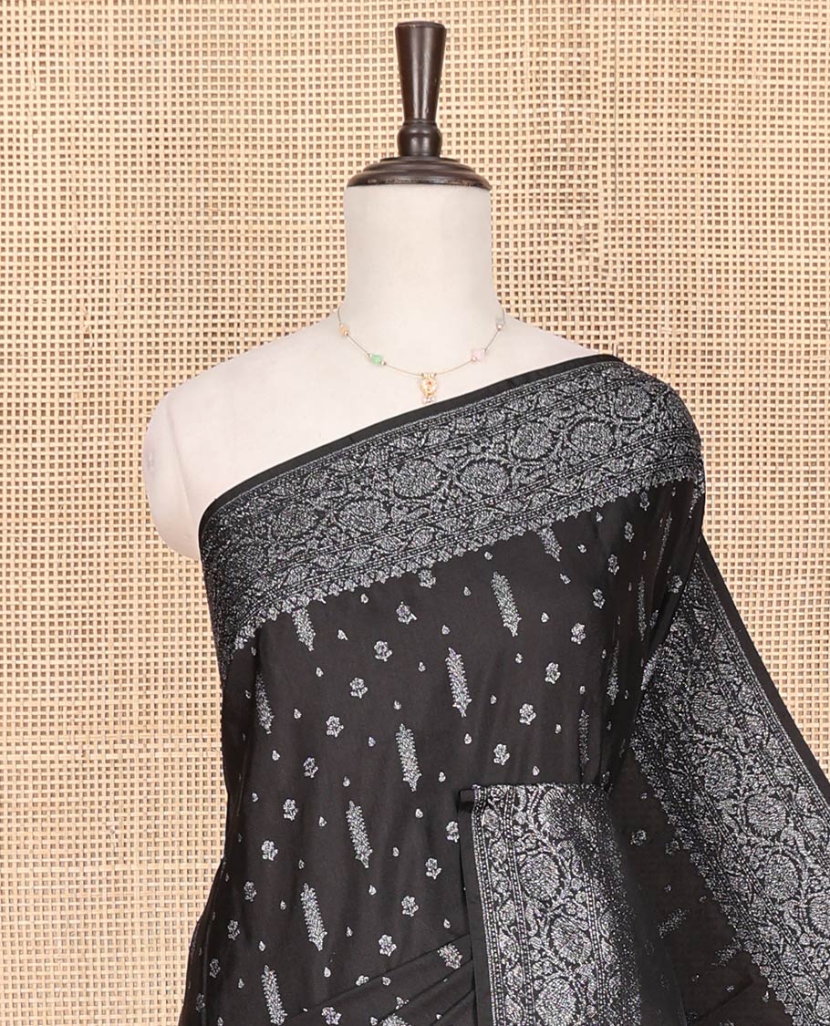Black Fancy Georgette Saree Decorated with Zari Buttas, Zari Woven Border of Floral Creeper Designs, Zari-Decked Up Pallu of Floral Jaal Designs, and Paired with a Matching Blouse