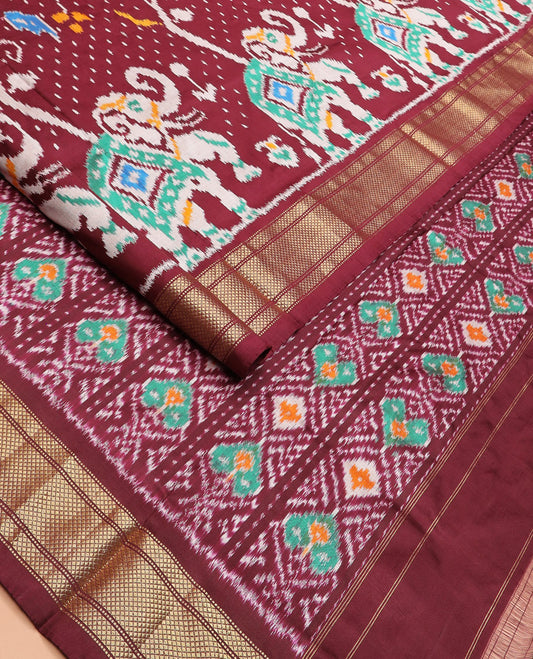 Maroon Ikkat Silk Saree with Colourful Elephant and Free-Style Ikkat Buttas, a Subtly Woven Zari Border, a Vibrantly Woven Pallu of Ikkat Patterns, and a Plain Blouse