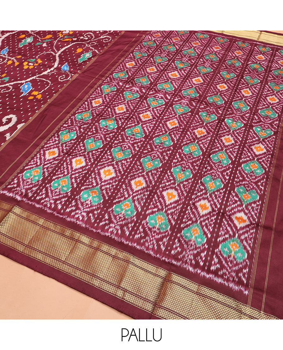 Maroon Ikkat Silk Saree with Colourful Elephant and Free-Style Ikkat Buttas, a Subtly Woven Zari Border, a Vibrantly Woven Pallu of Ikkat Patterns, and a Plain Blouse