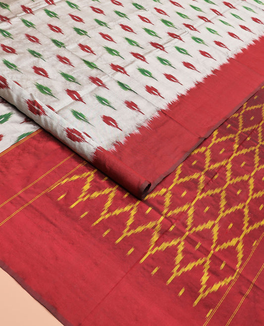 Grey Ikkat Silk Saree Adorned with Ikkat Buttas, Featuring a Contrast Plain Border, Complemented by a Pallu Ikkat Woven in an Ogee Pattern