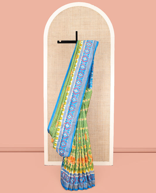 Green Ikkat Silk Saree, Enriched with Elephant Motifs Ikkat Weave All Over Its Body, Complemented by a Contrast Temple Border of Diamond Designs, Pallu of Ikkat Designs, and Paired with a Contrast Blouse