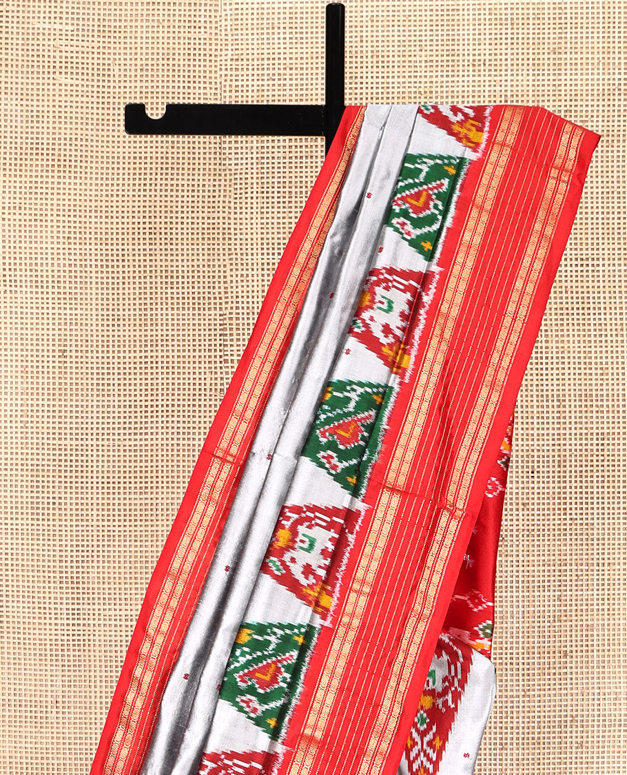 Grey Pochampally Ikat Silk Saree, Subtly Woven with Ikkat Buttas on Its Body, Complemented by a Contrast Temple Border of Traditional Designs, Pallu of Butta Enclosed Checks, and Paired with a Contrast Blouse