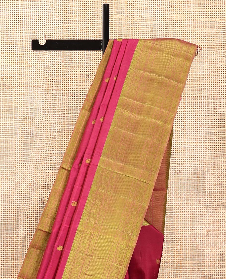 Red Kanchipuram Designer Silk Saree, Subtly Sparkled With Buttas All Over Its Body, Complemented by Contrast Border of Rekku, Rudraksham, Then Kuli Kann, Laddu Kamalam, and Mayil Kann Designs, Jaal Pallu and Paired with a Contrast Blouse