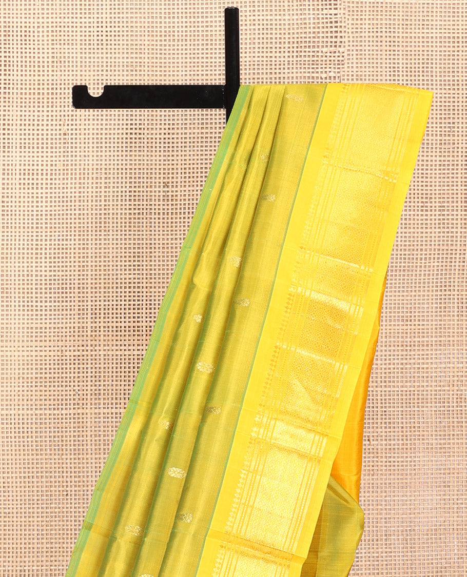 Green Kanchipuram Silk Saree, Woven with Zari Buttas, a Contrast One-Sided Border of Panner Sombu, Banaras, Muthu, and Jaal Design, Zari-Woven Pallu, and No Blouse
