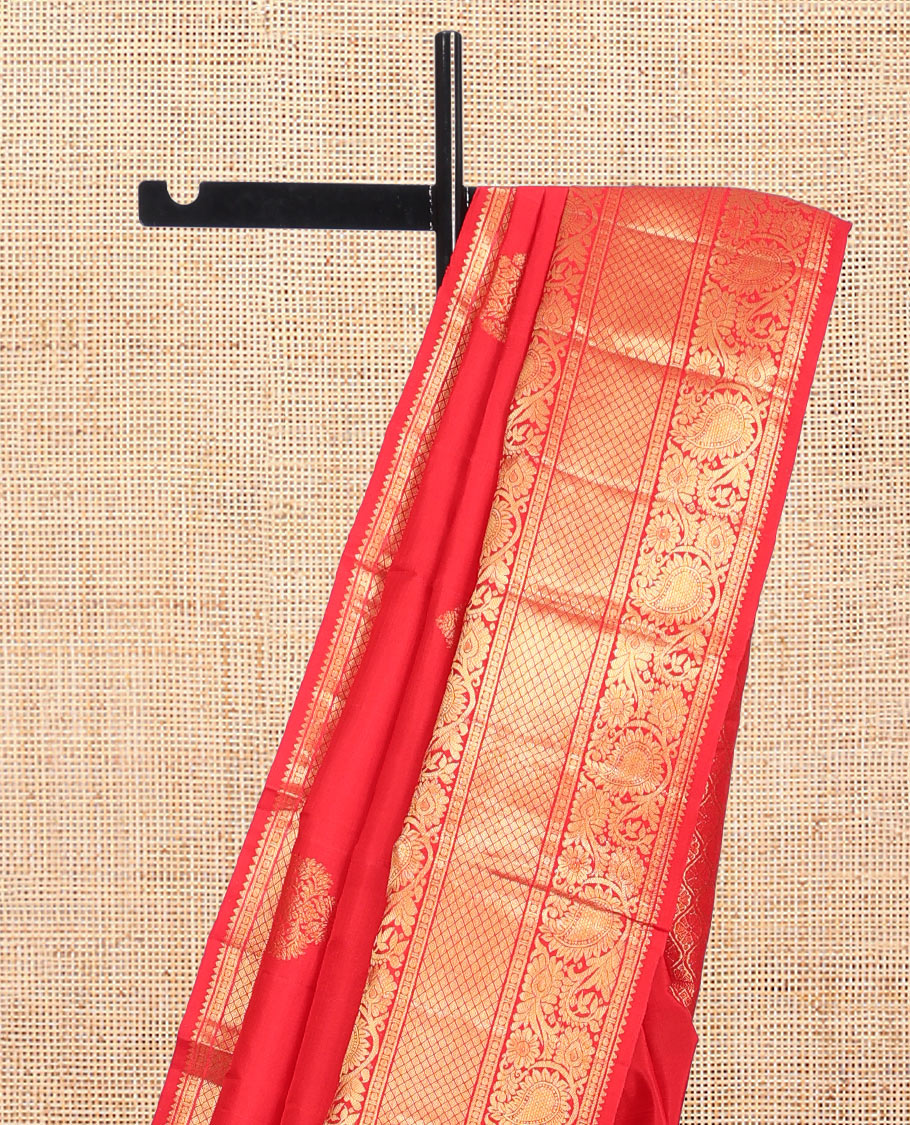 Red Kanchipuram Silk Saree, Spotlighted with Zari Buttas, Highlighted by Zari Border of Rekku, Rudraksham, Paisley Vine and Jaal Designs, Jaal Pallu, and a Matching Blouse