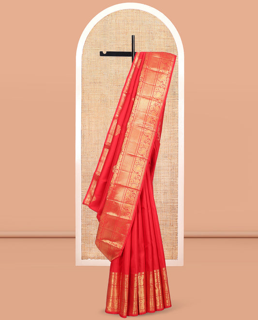 Red Kanchipuram Silk Saree, Spotlighted with Zari Buttas, Highlighted by Zari Border of Rekku, Rudraksham, Paisley Vine and Jaal Designs, Jaal Pallu, and a Matching Blouse