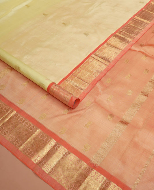 Cream zari buttas Kanchipuram silk saree, contrast one-sided border of banaras, chakram, and mayil kann designs, and zari design pallu