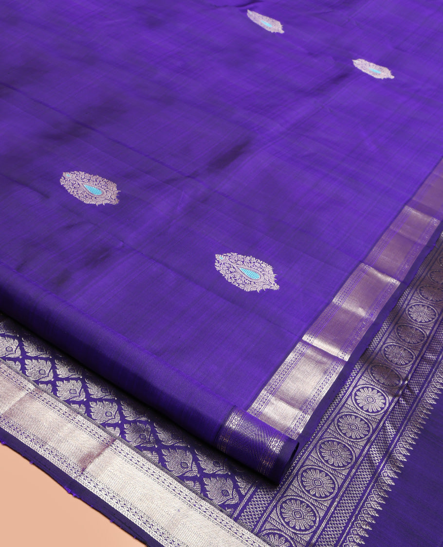 Violet Kanchipuram Silk Saree, Embellished with Zari Buttas All Over Its Body, Highlighted by Zari Border of Muthu and Neli Designs, Grand Pallu, and Paired with a Matching Blouse