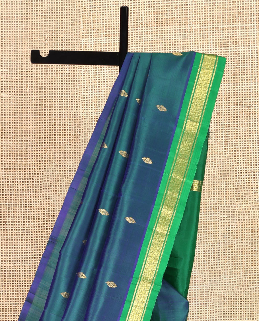 Blue Kanchipuram Silk Saree Featuring Zari Buttas, Complemented by a Contrast One-Sided Border of Banaras, and Jaal Design, Zari Design Pallu, and a No Blouse