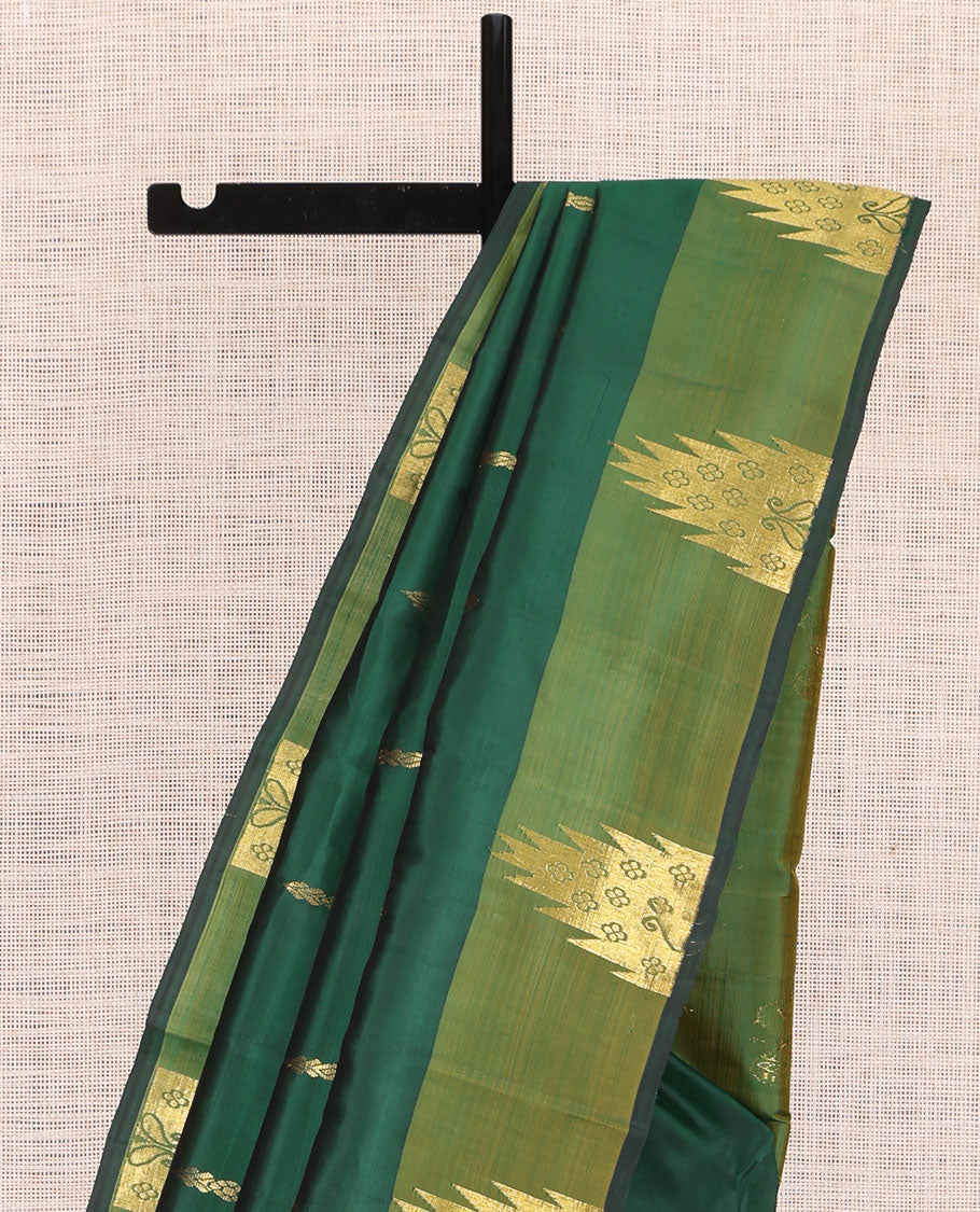 Green Kanchipuram Silk Saree, Highlighted by Zari Buttas, a Contrast Thazampoo Rekku Border, Zari Design Pallu, and a Contrast Blouse