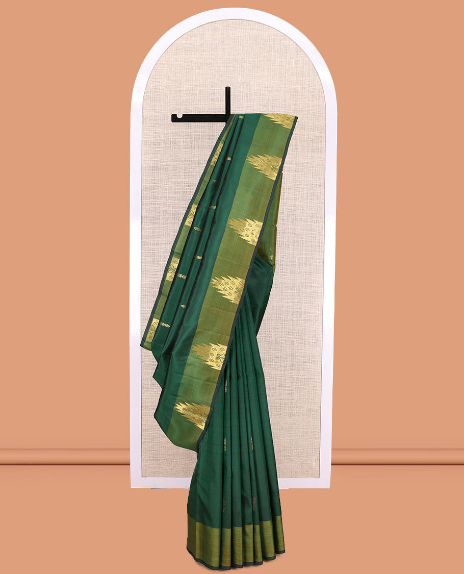 Green Kanchipuram Silk Saree, Highlighted by Zari Buttas, a Contrast Thazampoo Rekku Border, Zari Design Pallu, and a Contrast Blouse