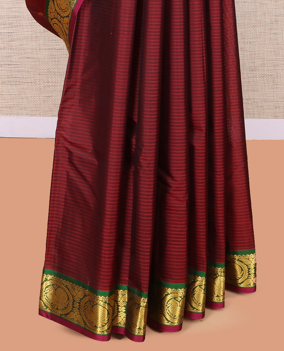 Maroon Kanchipuram Silk Saree, Elevated with Vazhaipoo Stipes and Zari Buttas, a Contrast Traditional Mayil Motif Border, Pallu of Zari Design, and Contrast Blouse