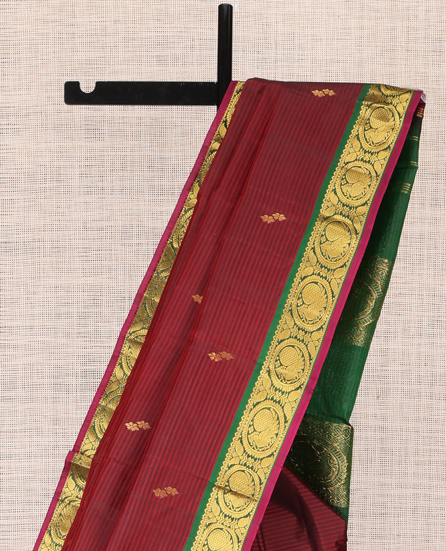Maroon Kanchipuram Silk Saree, Elevated with Vazhaipoo Stipes and Zari Buttas, a Contrast Traditional Mayil Motif Border, Pallu of Zari Design, and Contrast Blouse