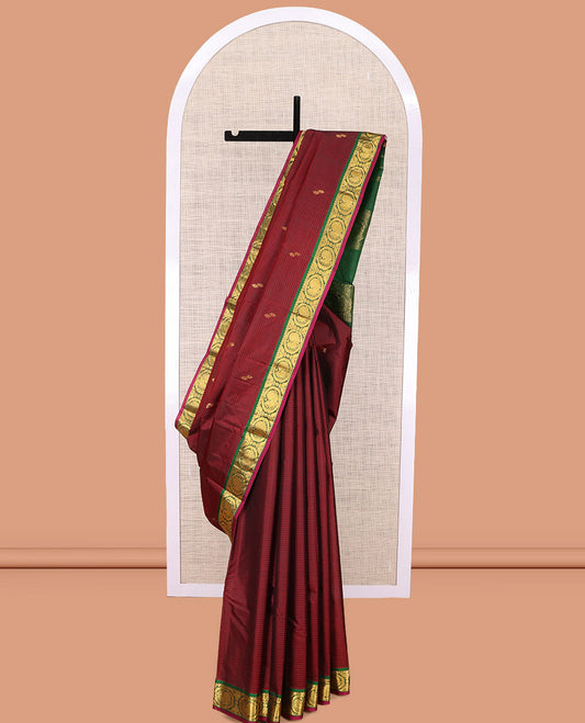 Maroon Kanchipuram Silk Saree, Elevated with Vazhaipoo Stipes and Zari Buttas, a Contrast Traditional Mayil Motif Border, Pallu of Zari Design, and Contrast Blouse