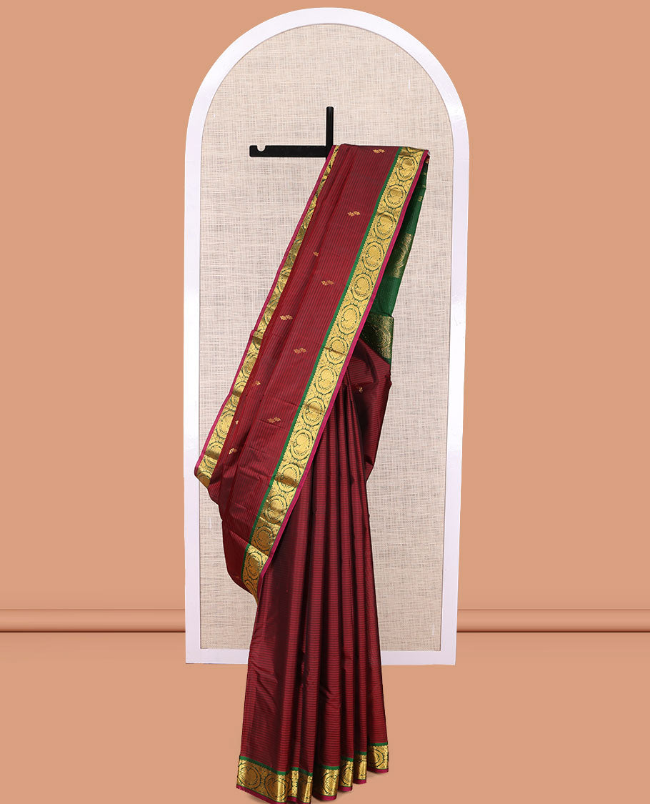 Maroon Kanchipuram Silk Saree, Elevated with Vazhaipoo Stipes and Zari Buttas, a Contrast Traditional Mayil Motif Border, Pallu of Zari Design, and Contrast Blouse