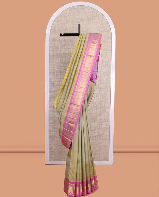 Green Kanchipuram Silk Saree, Embellished with Zari Buttas, a Contrast One-Sided Border of Paneer Sombu, Banaras, Muthu, and Mayil Kann Design, Zari Design Pallu, and No Blouse