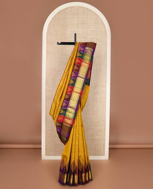 Mustard zari buttas silk saree, contrast one-sided temple border of muthu, kathir & zari stripes & kaleidoscopic-colored striped pallu of zari stripes