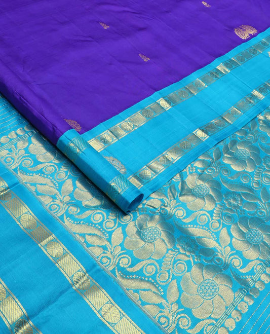 Blue zari buttas Kanchipuram silk saree, contrast one-sided korvai border of rudraksham and mayil designs, and floral design pallu