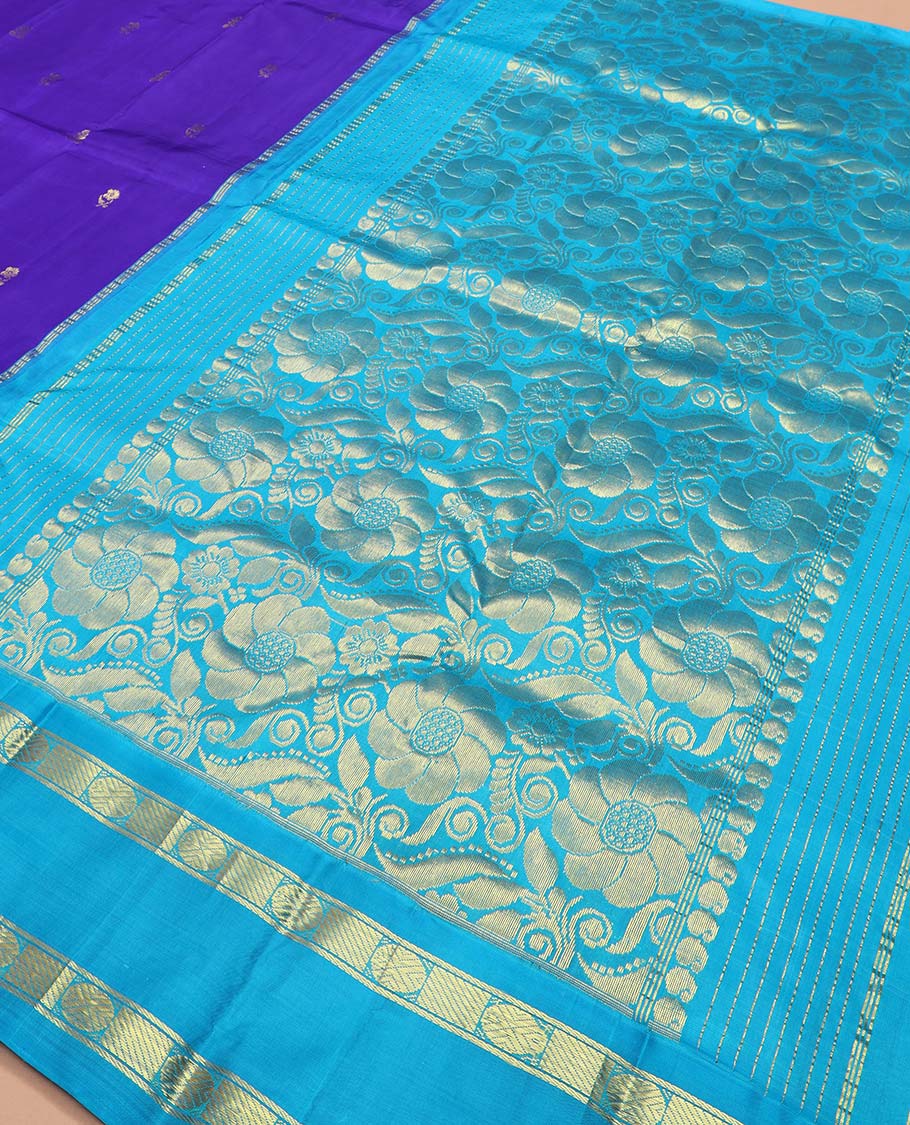 Blue zari buttas Kanchipuram silk saree, contrast one-sided korvai border of rudraksham and mayil designs, and floral design pallu