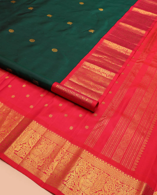 Green mayil chakram buttas Kanchipuram silk saree, contrast border of thilakam mokku, cross kamalam, and mayil designs, and zari design pallu