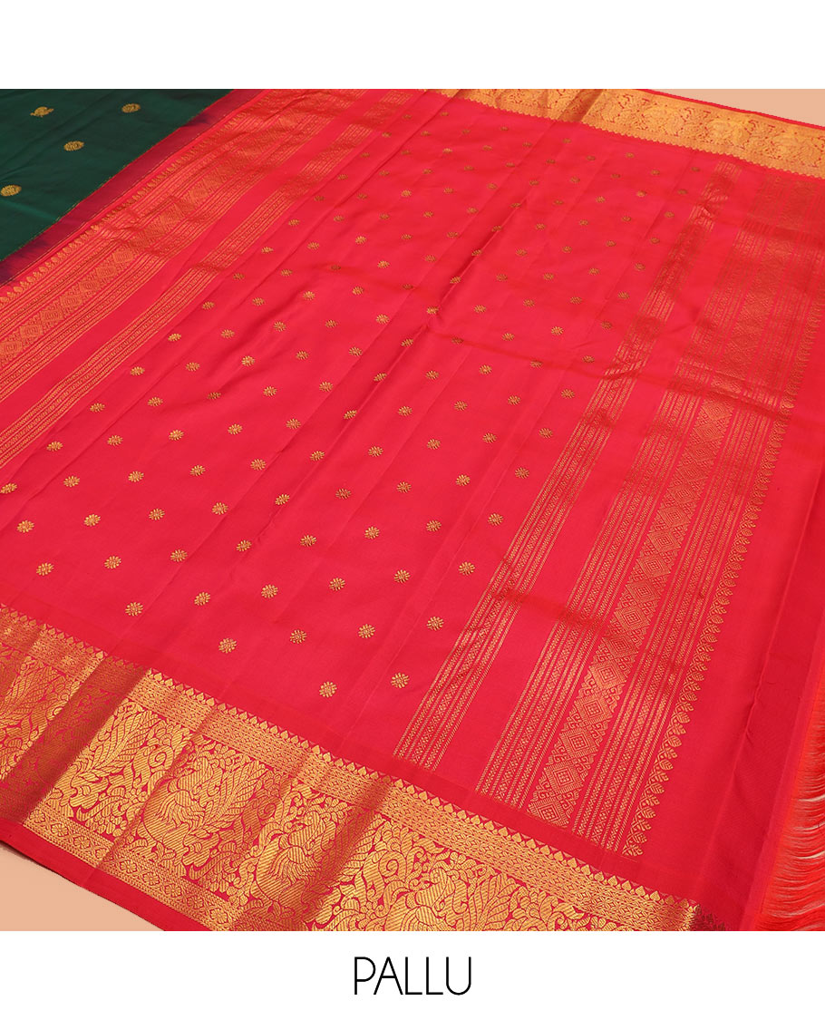 Green mayil chakram buttas Kanchipuram silk saree, contrast border of thilakam mokku, cross kamalam, and mayil designs, and zari design pallu