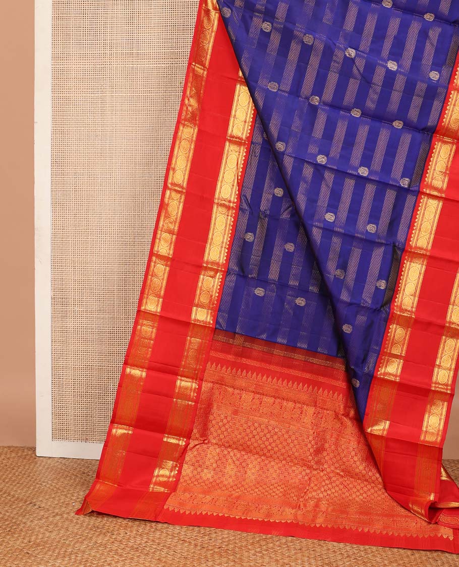 Blue zari stripes, and buttas Kanchipuram korvai silk saree, contrast rettai pettu neer korvai border of thilakam mokku, neli, muthu, kodi visiry, manga, yaanai, and mayil designs, and vanki design pallu