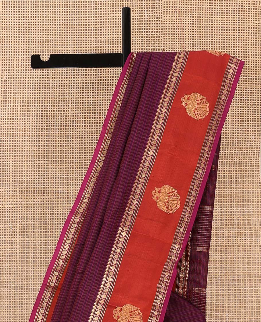 Purple striped Kanchipuram silk saree, contrast border of rekku, muthu, rudraksham and iruthalai pakshi motifs, and zari striped pallu