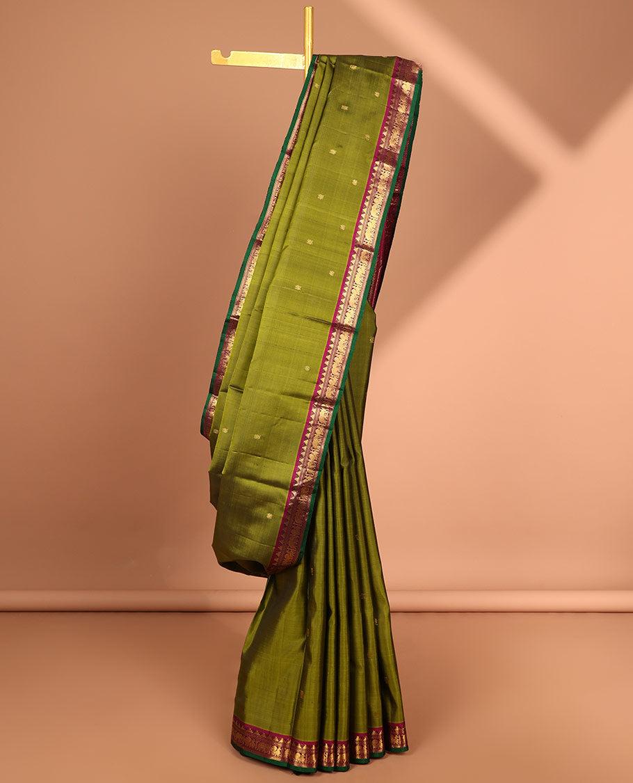 Green buttas kancheepuram silk saree with contrast border of rekku, muthu, yaanai design & checked zari design pallu