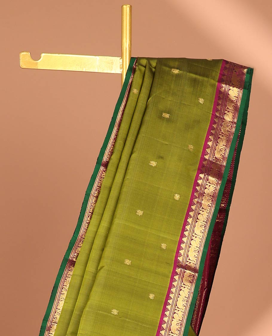 Green buttas kancheepuram silk saree with contrast border of rekku, muthu, yaanai design & checked zari design pallu